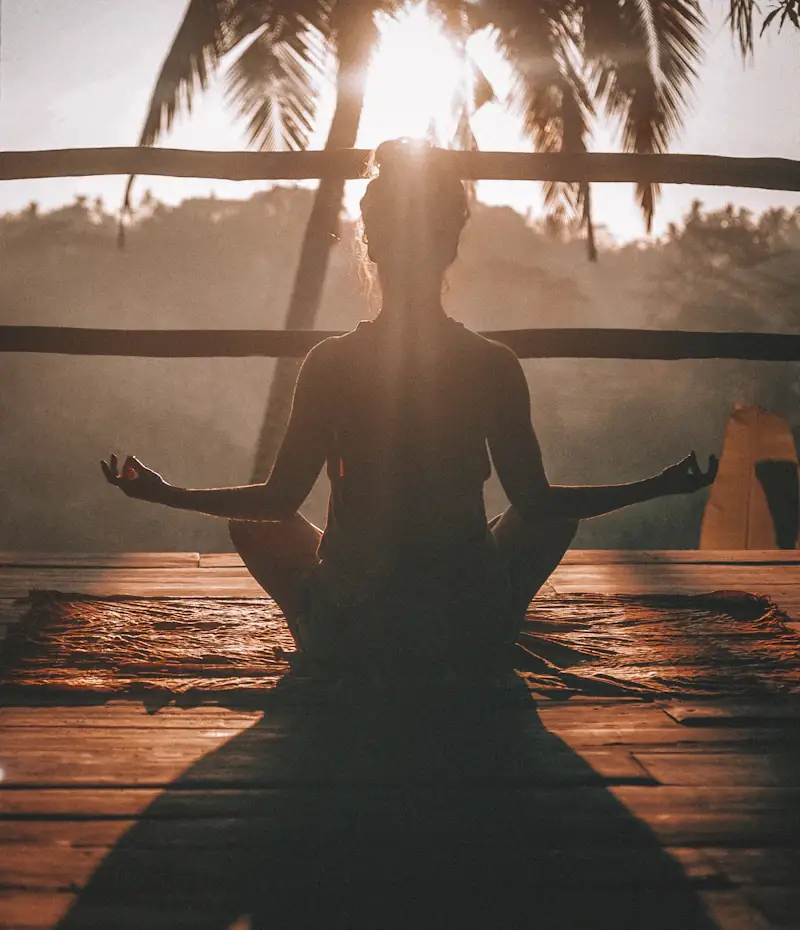 Person meditating in calm space